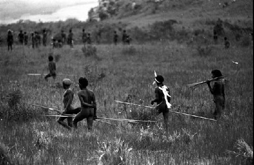 Spearmen walking through the marsh on their way to the Tokolik