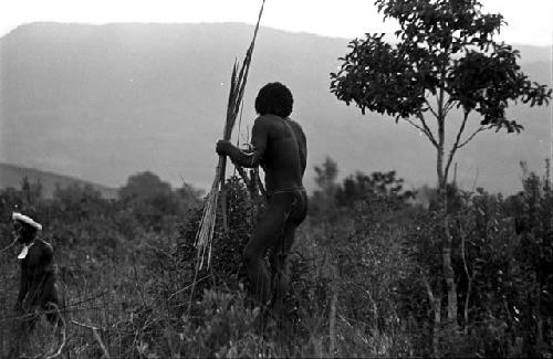 Warriors with spears closer to the front lines, calling out at the enemy