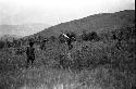 Warriors in action -- central figure preparing to throw a long spear