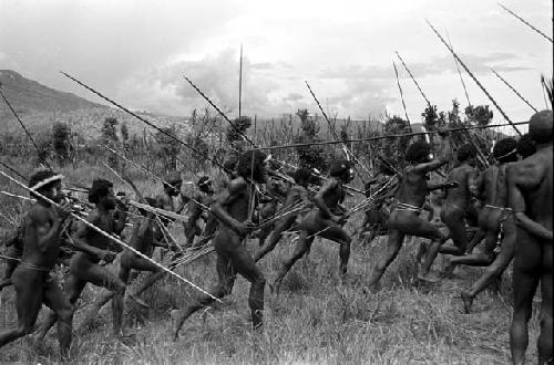 Warriors running with spears to the front line