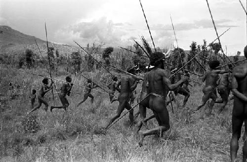 Warriors running with spears to the front line