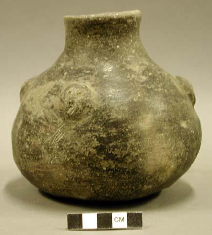 Ceramic vessel, burnished, short flared neck, 4 faces in relief at shoulder