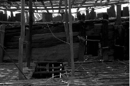 A sleeping platform in a honai that has not yet been thatched, in the new village of Kumina