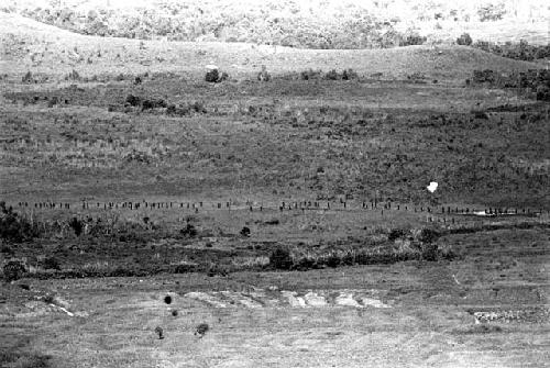 Lines of people in the valley, taken from high on the Tukumba