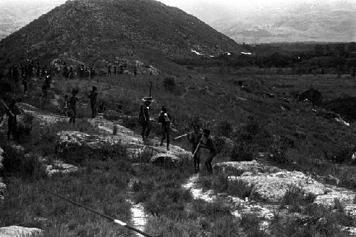 Men walking back from battle on the Warabara; Siobara beyond