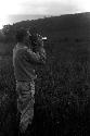 Robert Gardner filming warriors going home along the ridge of the Warabara