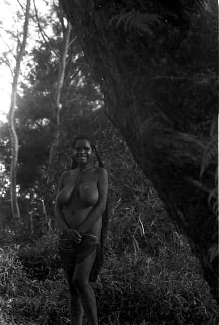 Woman seen standing on the bank of the Aikhé River