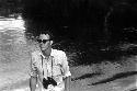 Peter Matthiessen arriving from a boat on the Aikhé River