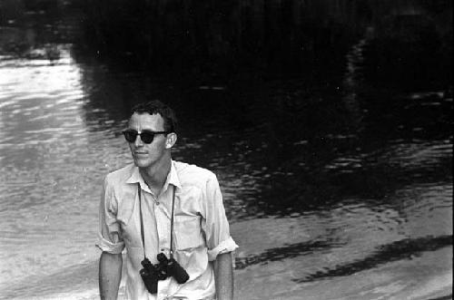 Peter Matthiessen arriving from a boat on the Aikhé River