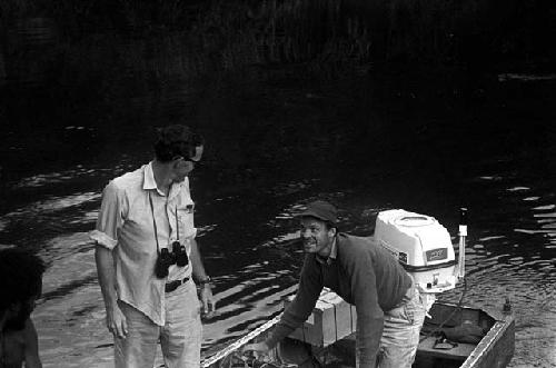 Peter Matthiessen and Robert Gardner arriving by boat