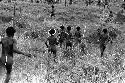 Men running down to join the action at a war on the Tokolik