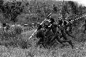 Warriors sprinting to the battle front with long spears in hand