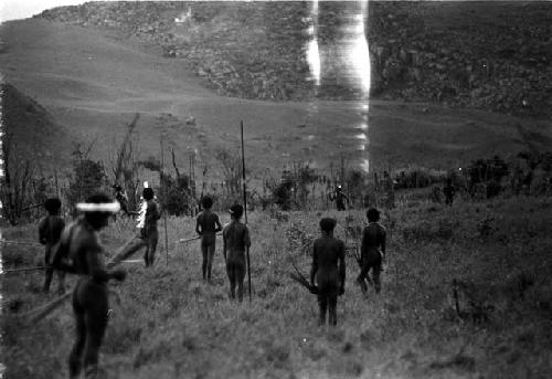 Warriors standing with weapons in hand -- damaged negative