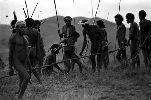 Men coming back from the battle front with their weapons