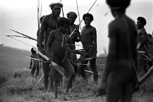 Men coming back from the battle front with their weapons