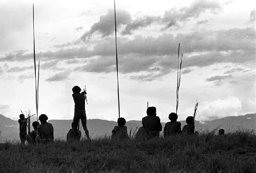 Men waiting with their weapons