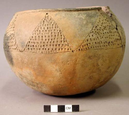 Ceramic complete vessel, punctated