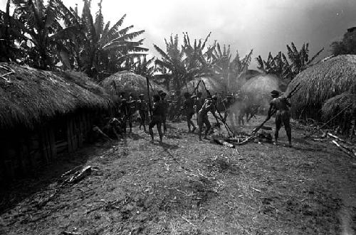 Men lifting stones from a fire, to be put into the haksé