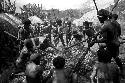 Men lifting stones from a fire, to be put into the haksé
