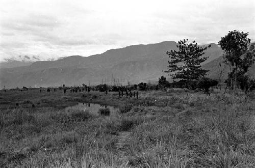 Warriors returning home past the pond on the Tokolik