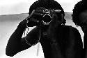 Tekman Biok looks through a Nikon camera