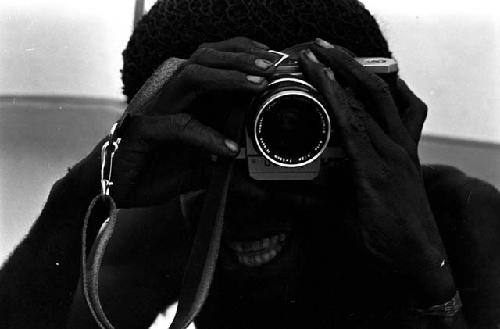 Tekman Biok looks through a Nikon camera