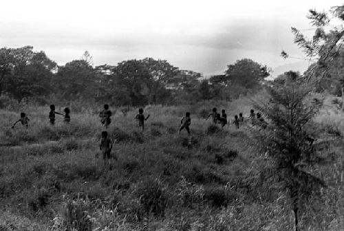 Men and boys playing on a field