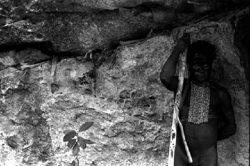 Detail of Wittaia bones; Yege Asuk standing in front of it
