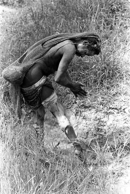 woman putting on clay