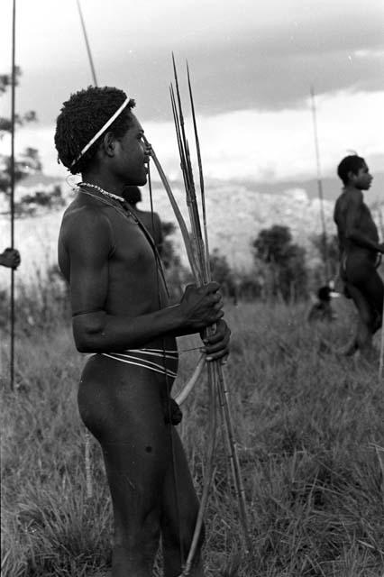 man with a sue lare and a spear