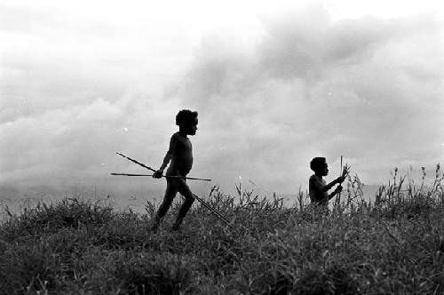 Tukom (center) plays in a war game