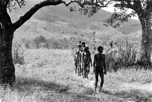 Men on their way to Ekiarotmilek's funeral