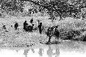 Women putting on clay near Kibit Silimo