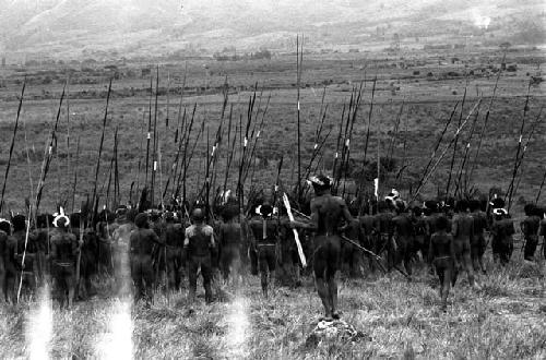 Men leaving a war on the Warabara -- damaged negative