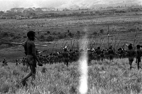 Men leaving a war on the Warabara -- damaged negative