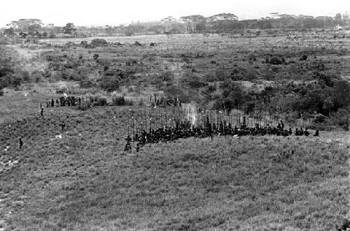 Men leaving a war on the Warabara; going through the marsh