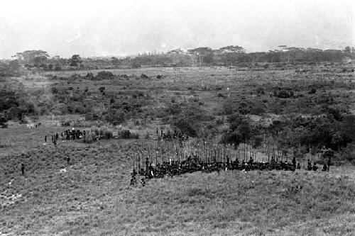 Men leaving a war on the Warabara; going through the marsh