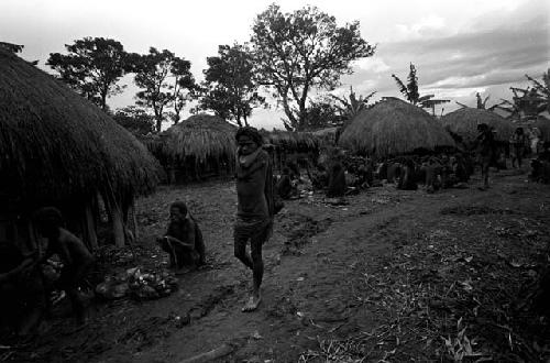 Women leaving Ekiarotmilek's funeral at Kibit Silimo