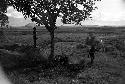 A child watches Polik on the path to Abukulmo with his big spear