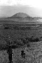 Men returning home from their kaios; the Siobara is visible in the distance