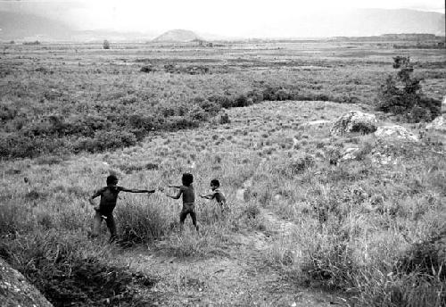 Children playing on the Anelerak; Siobara visible in the distance