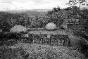 Asikanilep works on a new hunu in Abukulmo, Nameliké in foreground