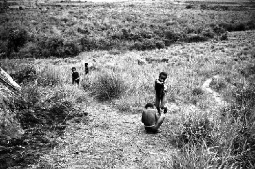 Boys playing over the edge of the Anelerak