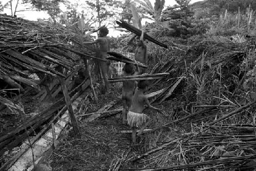 Tearing apart an old hunu in Abukulmo