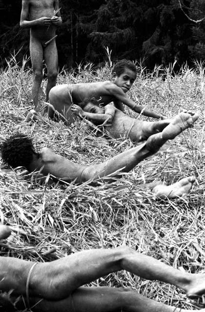 Kusa and Tukom indian wrestle; learned this from Michael Rockefeller near Homoak