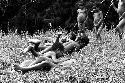 Children playing in the grass near Homoak