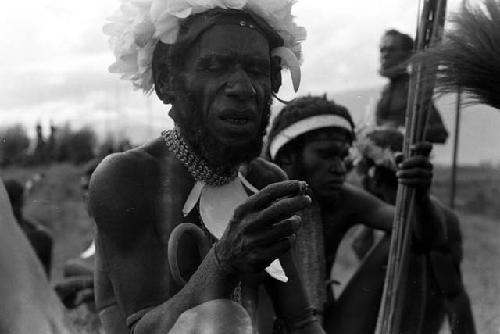 Maitmo among a group of warriors waiting for a battle