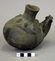 Black ware pottery vessel - melon-shaped