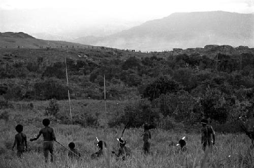 Warriors watch a distant battle on the Warabara