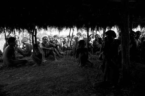 Men under an oléa on the Liberek